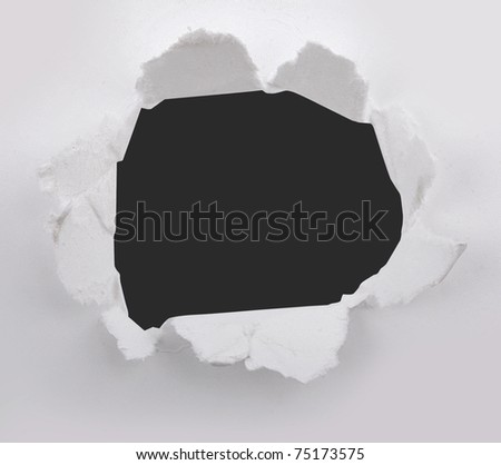 Closeup of a dark hole on white paper set