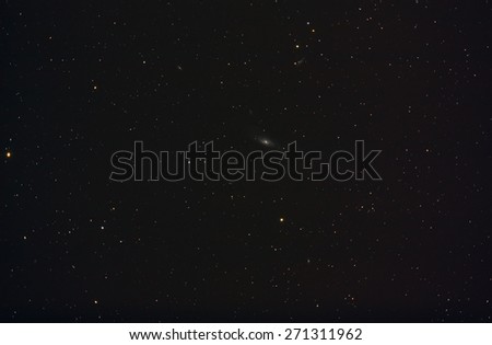 The galaxy Messier 106 in a wide field. It is located in the vicinity of the constellation Ursa Major