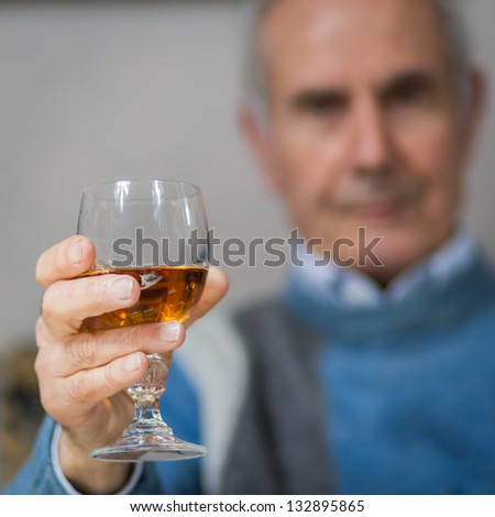 Old man making a toast(drinking)