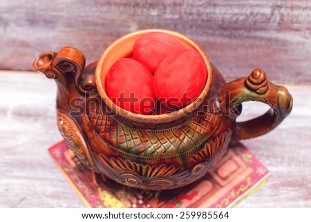 Easter red eggs and soup tureen