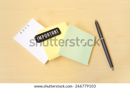 Important Three Colors Paper Notes and Black Pen on Wooden Texture