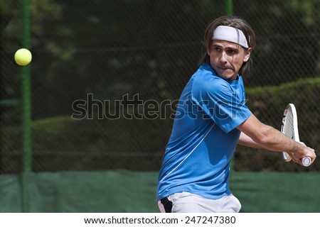 Male tennis player in action