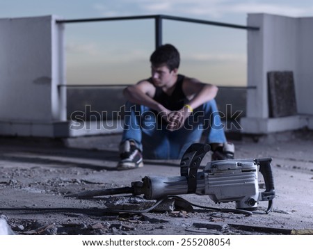 worker resting on a rooftop