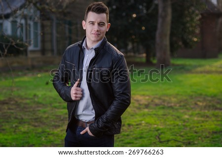 Attractive young male model posing outdoors