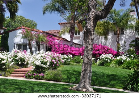 Spanish House with Pink and White Blooming Flowers