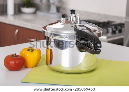 double valve pressure cooker on white background