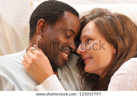 African american man and caucasian woman enjoying some quiet time.