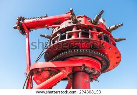 Metal machine that powers an amusement ride with chain and gears