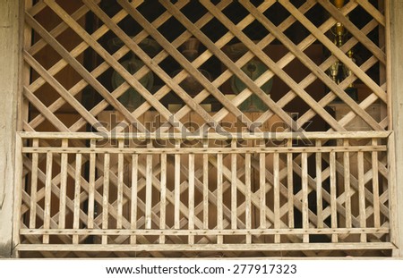 Vintage Pattern of Wood Craft used as a partition to divide rooms or department in Thai traditional House, it can also be used as a background of display room for any purpose.