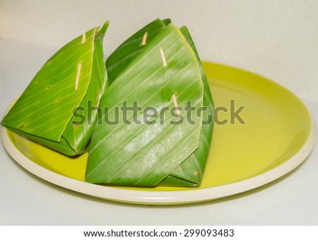 Coconut cream sticky rice and Thai custard wrapped in banana leaf