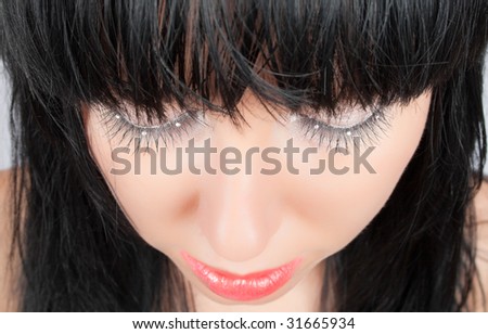 portrait of   alluring brunette with closed eyes isolated on white with clipping path