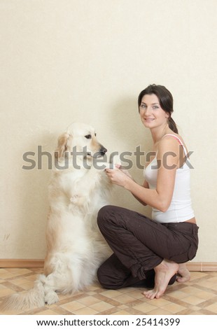 girl plays with dog