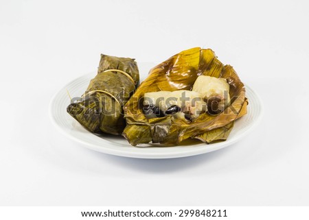 Thai banana in sticky rice wrap by banana leaf  put on isolate white background