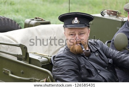 KIEV, UKRAINE - MAY 13: Members of Red Star history club. Portrait of the naval officer of the Soviet army with a pipe. Historical reenactment of 1945 WWII, May 13, 2012 in Kiev, Ukraine.