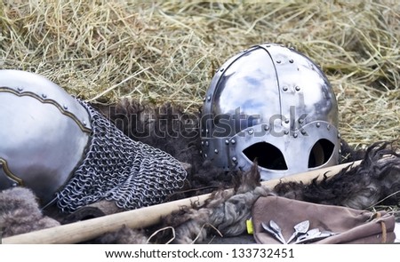 knight\'s helmet on a background of hay