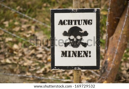 warning sign with German text Watch out mines