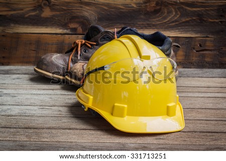 Industrial Protective Workwear. Includes leather boots, safety glasses and hardhat