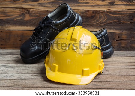 Industrial Protective Workwear. Includes leather boots, safety glasses and hardhat