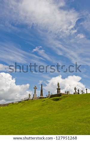 Graveyard in Cashel (Ireland), popular tourist attraction on a beautiful cloudy summer day.