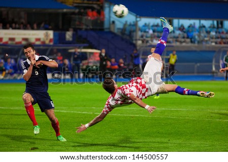 ZAGREB, CROATIA - JUN 07: 2014 FIFA World Cup Brazil Preliminaries: Croatia VS. Scotland June 07, 2013 Zagreb, Croatia. Mario MANDZUKIC (right) doing scissor kick