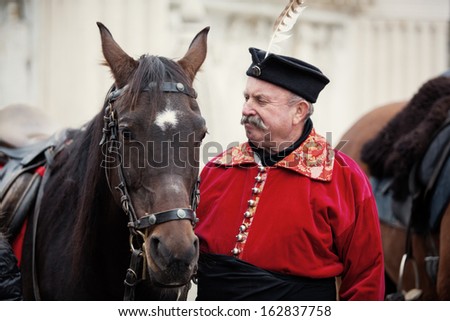 BUDAPEST, HUNGARY - OCT 19: Horseman with horse in front of Matthias church on October 19, 2013 in Budapest, Hungary. This is one of many performances for tourists