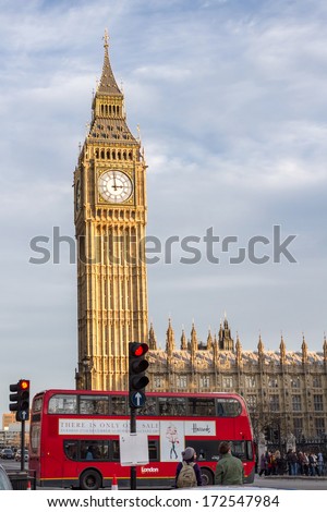LONDON, UNITED KINGDOM - DECEMBER 28, 2011: Red double-decker in front of the Big Ben. The clock is housed within the clock tower officially named Elizabeth Tower.