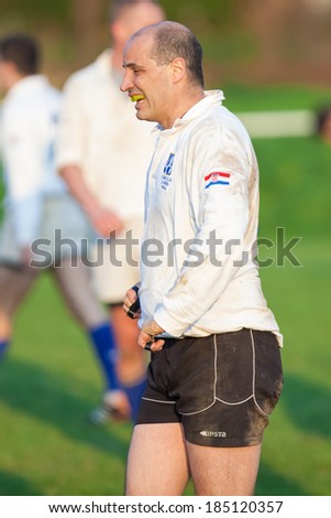 ZAGREB, CROATIA - MARCH 29, 2014: Friendly rugby match RC Zagreb Old Lions in white jersey (CRO) and Reigate RFC in blue jersey (UK). Unidentified Zagreb player.