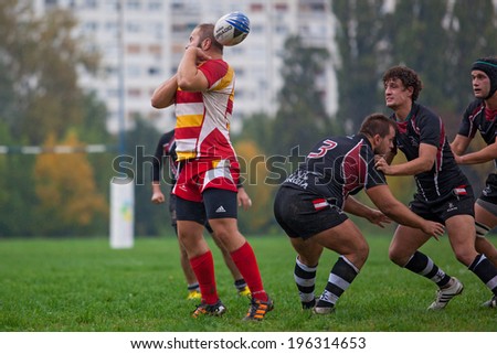 ZAGREB, CROATIA - OCTOBER 12, 2013: Friendly rugby match between RC Mladost (red-yellow jersey) and Austrian National Team (black jersey).  Unidentified players in action