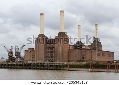 LONDON, ENGLAND - DECEMBER 28, 2011:  Silhouette of Battersea Power Station viewed from the bank of the Thames. Power Station is being redeveloped by an international consortium.