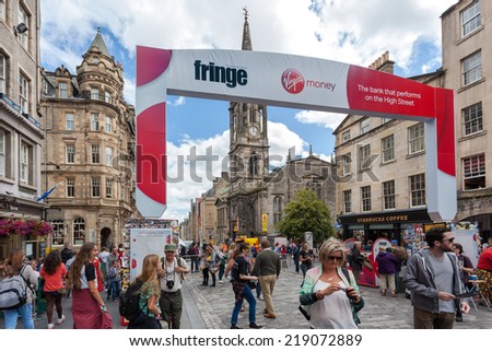 EDINBURGH, SCOTLAND: AUGUST 8, 2014: People at Fringe festival. Fringe is the very popular and largest arts festival in the world.