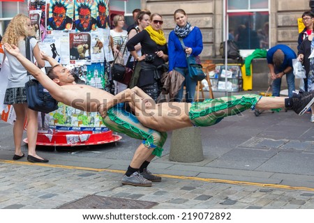 EDINBURGH, SCOTLAND: AUGUST 8, 2014: Artists performing on Fringe festival. Fringe is the very popular and largest arts festival in the world.