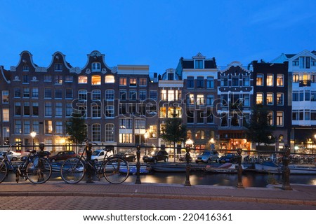 AMSTERDAM - NETHERLANDS: AUGUST 1, 2014: Night shot of typical Amsterdam houses at Prinsengracht.