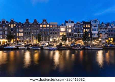 AMSTERDAM - NETHERLANDS: AUGUST 1, 2014: Night shot of typical Amsterdam houses at Prinsengracht.