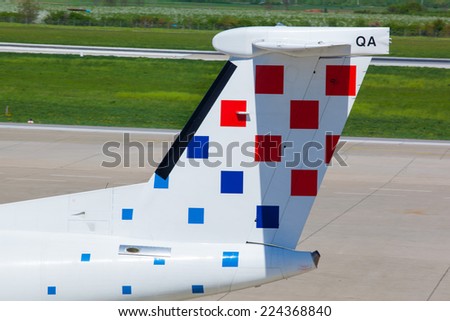 ZAGREB, CROATIA - APRIL 28, 2013: Croatia Airlines Bombardier Dash 8-Q400 tail with company logo on Pleso airport runway.
