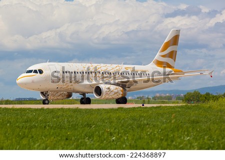 ZAGREB, CROATIA - APRIL 28, 2013: British Airways Airbus A319 decorated for London Olympics 2012 to look like golden dove taxiing on Pleso airport runway.