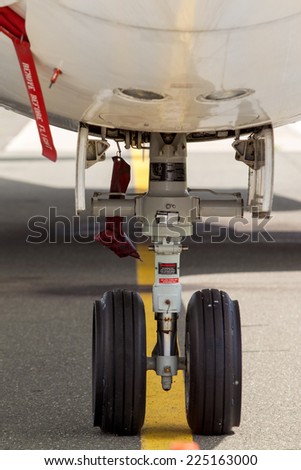 ZAGREB, CROATIA - APRIL 28, 2013:  Closeup of front  wheels of SunAdria Fokker F-100 parked on Pleso Airport.
