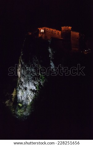 BLED, SLOVENIA - 25 OCTOBER, 2014: Night shot of Bled castle perched at top a steep cliff rising 130 metres above the glacial Lake Bled.