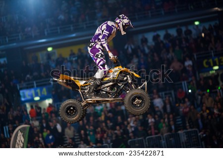 ZAGREB, CROATIA - MARCH 30, 2013: Quad driver performing on Masters of dirt 2013 - Freestyle motocross show.