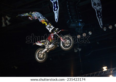 ZAGREB, CROATIA - MARCH 30, 2013: FMX motorbike driver performing on Masters of dirt 2013 - Freestyle motocross show.