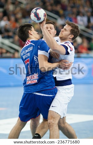ZAGREB, CROATIA - DECEMBER 9, 2014: EHF Men\'s Champions League, match between HC Zagreb and HC Paris Saint-Germain. Luka STEPANCIC (7)  and William ACCAMBRAY (6)