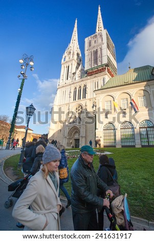 ZAGREB, CROATIA - DECEMBER 24, 2014: People walking in front of the Cathedral of Assumption of the Blessed Virgin Mary.