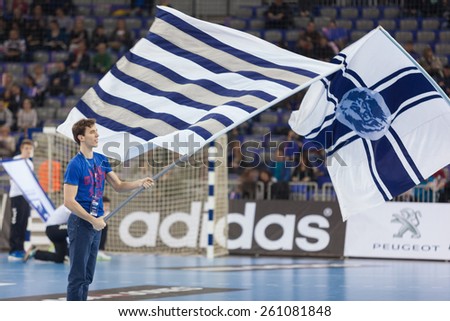 ZAGREB, CROATIA - MARCH 14, 2015: EHF Men\'s Champions League - last 16, match between HC Zagreb PPD and HC Kolding Copenhagen. Young supporter waving Zagreb\'s flag before the match.