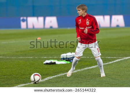 ZAGREB, CROATIA - MARCH 28, 2015: EURO 2016 qualifiers, group H - Croatia VS Norway. Martin Odegaard (11) warming up before the match.