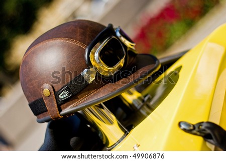 Old leather racing helmet with glasses