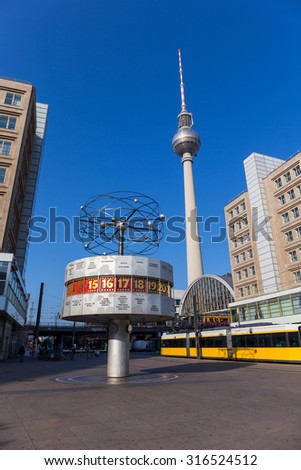Berlin, Germany - September 01, 2015. The World Clock, built 1969, on Alexanderplatz is a popular meeting place for locals and tourists. The TV tower (368 meters) is the tallest building in Germany.