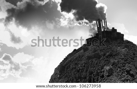 Collage of an empty planet\'s soil and smoking power plant