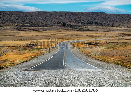 End of the asphalt road named Ruta 40 in Argentinian Patagonia. Asphalt road turns into gravel road on National road Ruta 40, Argentina.