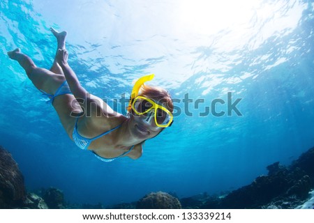 Underwater Shoot Of A Young Lady Snorkeling And Doing Skin Diving In A Tropical Sea