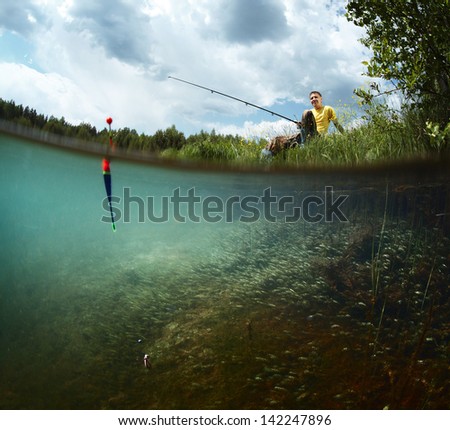 Young Smiling Man Fishing On A Green Pond\'S Coast With Underwater View Of Weed On A Bottom
