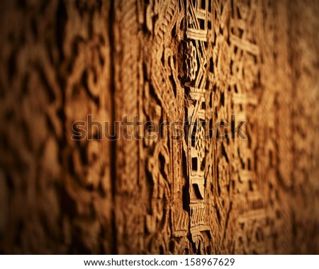 Grungy oriental texture on a wood. Door in one of Uzbekistans\' mosque